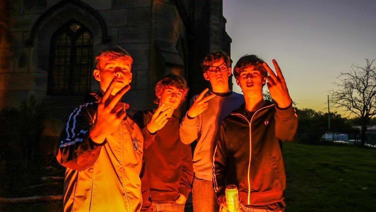 The Fleecers in colour at sunset outside a Stockport church