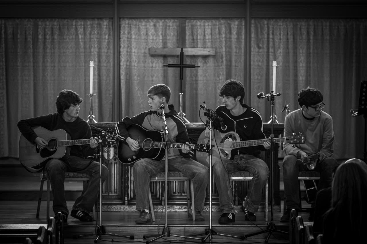 The Fleecers playing an acoustic set in a church
