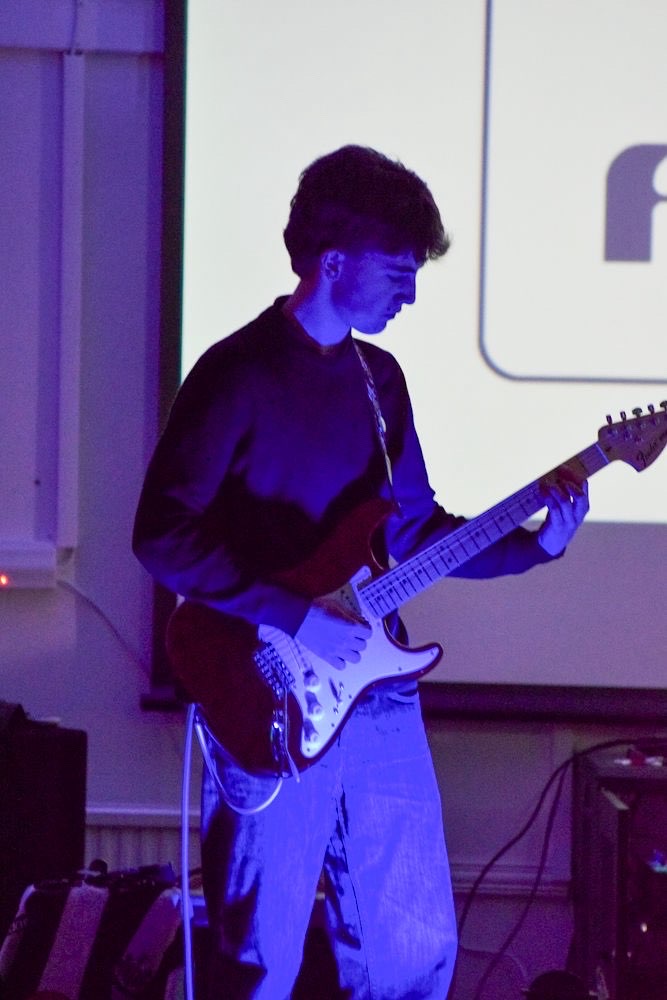 Lead guitar in blue stage wash
