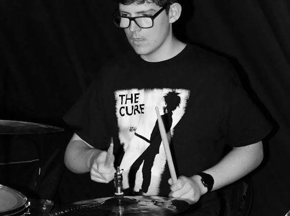 James Lister on drums in a Cure t-shirt